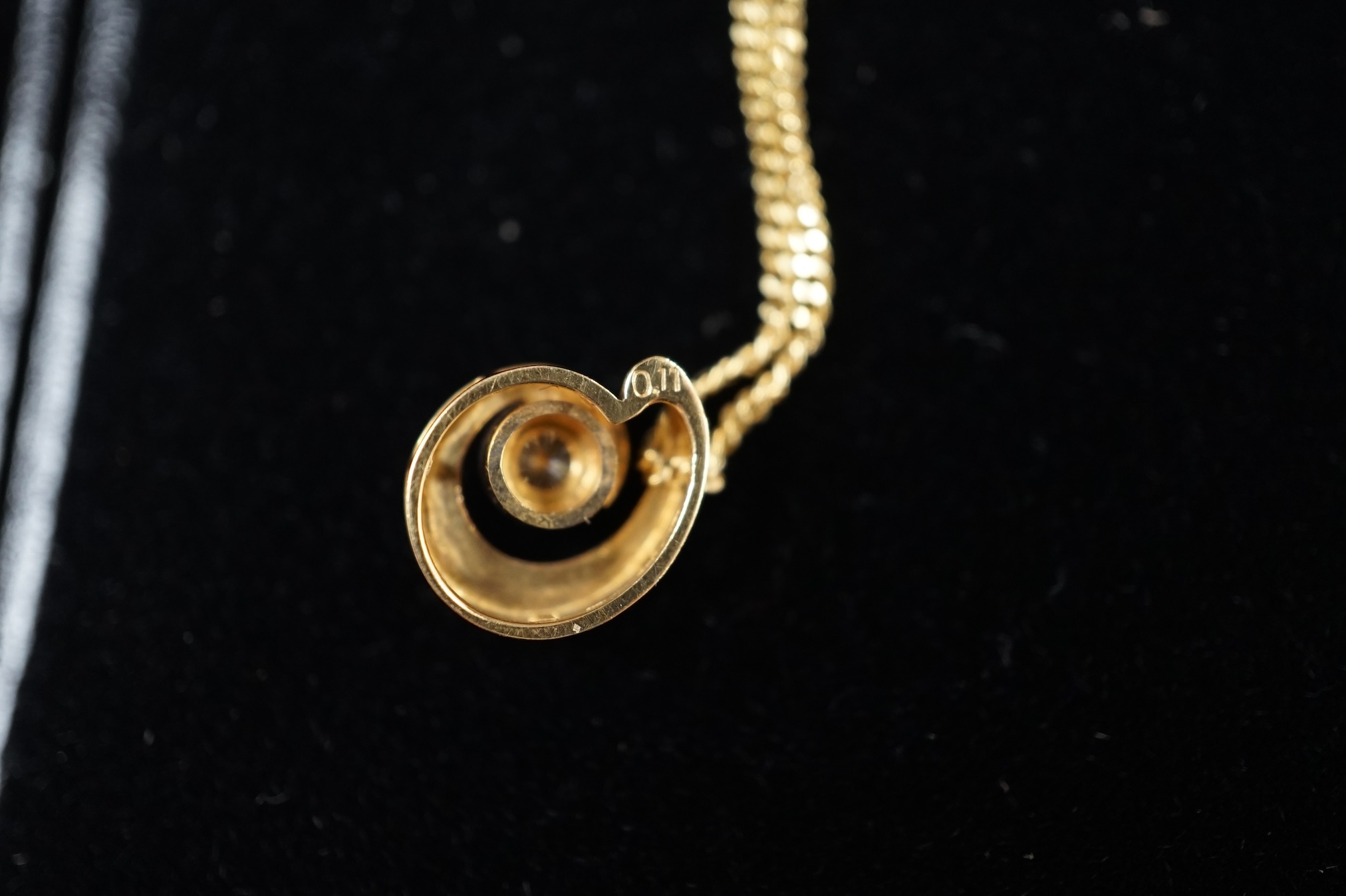 A modern yellow and white metal (stamped 18kt and Pt850), graduated three stone diamond set pendant necklace, 42cm, gross weight 7.1 grams and a an Italian Uno-A-Erre 18ct gold and solitaire diamond set necklace, 46cm, g